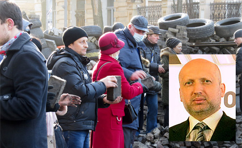 Ukrainian protestors building a barricade in Kiev. Insert Baptist Pastor Oleksadr Turchynov Wikipedia: 
