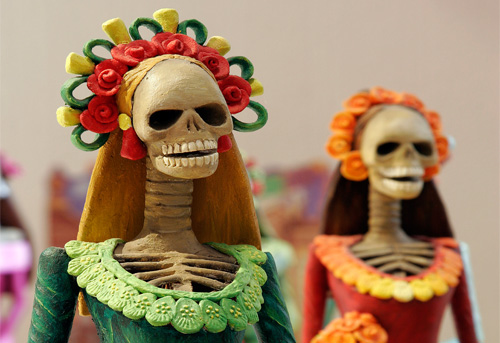 Catrina is a popular figure  in Mexico's Day of the Dead festival. It is celebrated by many Catholics in conjunction with All Saints Day November 1 and All Souls Day November 2. During the festival participants make altars honouring the dead and also pray for the dead. Photo: Wikipedia/Tomascastelzao