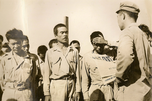 Japanese POWs stunned by announcement of Japanese surrender during World War II