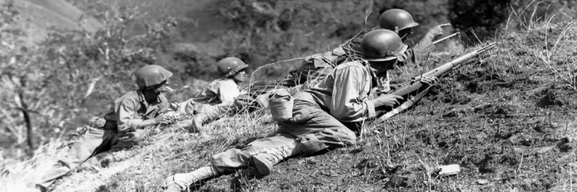 American soldiers advancing on Japanese positions in World War 2.