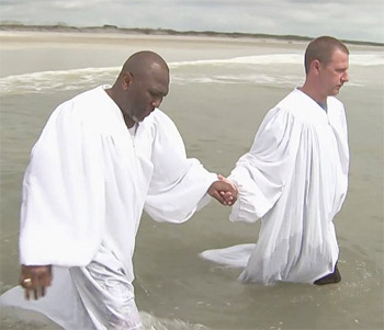Pastor McKinnon about to baptize Parker in the Atlantic Ocean Credit: NBC screen capture