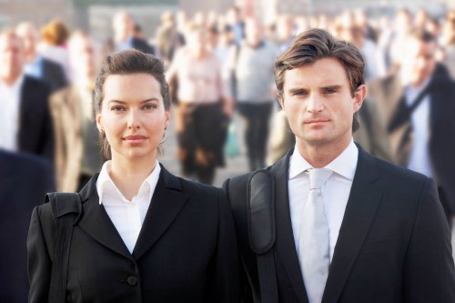 Man and Woman standing in front of large crow