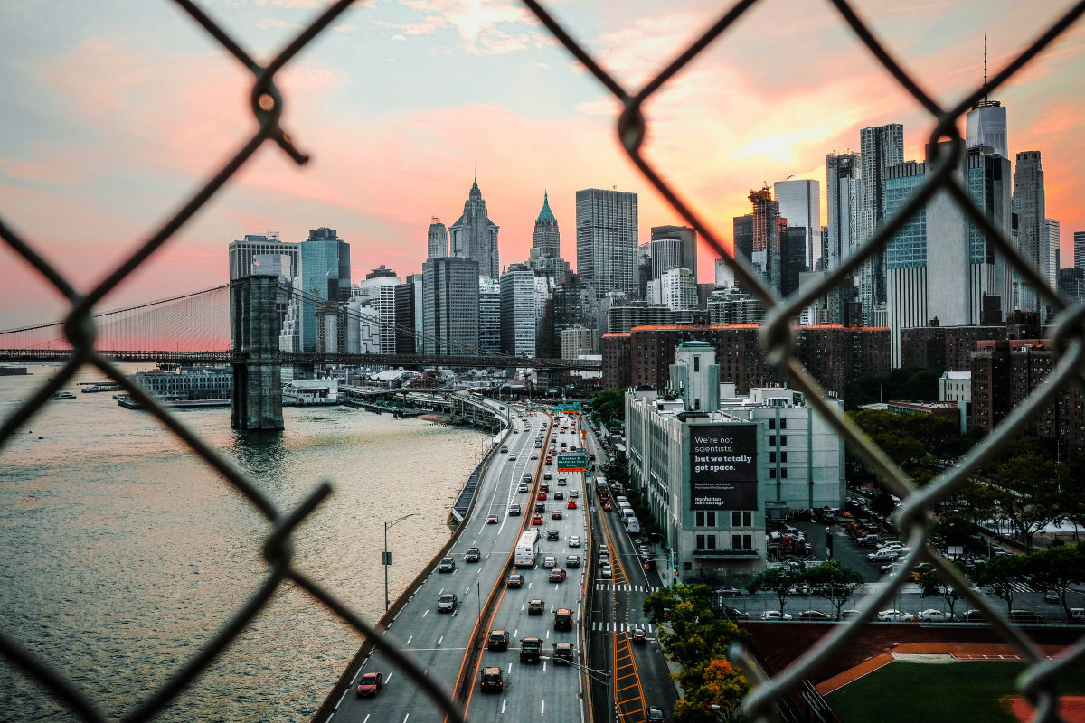 New York City seen through a hole in metal wire fence