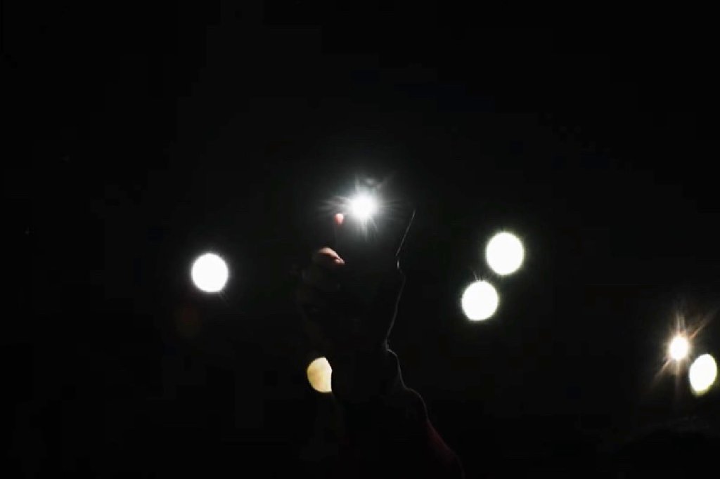 Hundreds lift their cellphones, signifying they received Christ during church’s Christmas&nbsp;programs