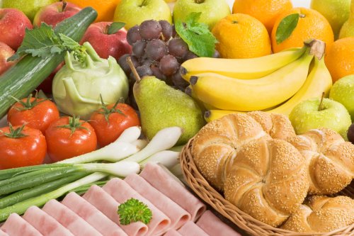 A photo of groceries including fruit, vegetables and baking