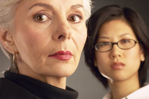 Two women looking serious