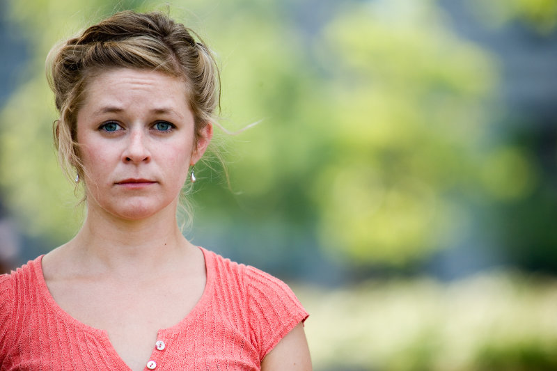 Sad woman standing outside