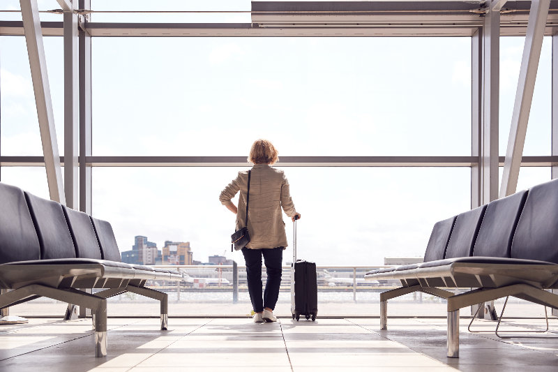 Woman standing in airport.