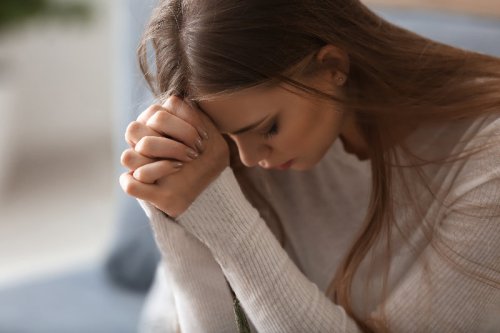 Woman praying at home