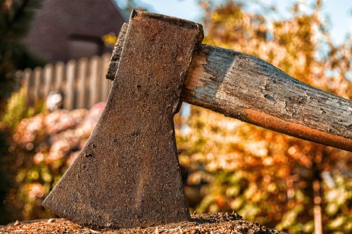 Old axe stuck in wood