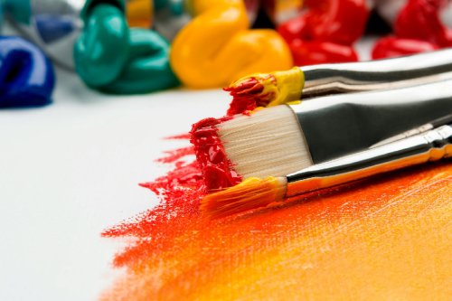 Paint brushes lying on a canvas