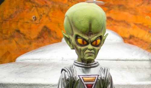Model of little alien green man and spacecraft used for photos during the Mars New Year's celebration Saturday, June 20, 2015, in Mars, Pennsylvania.