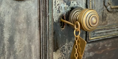 Photo of a skeleton key inside a door lock